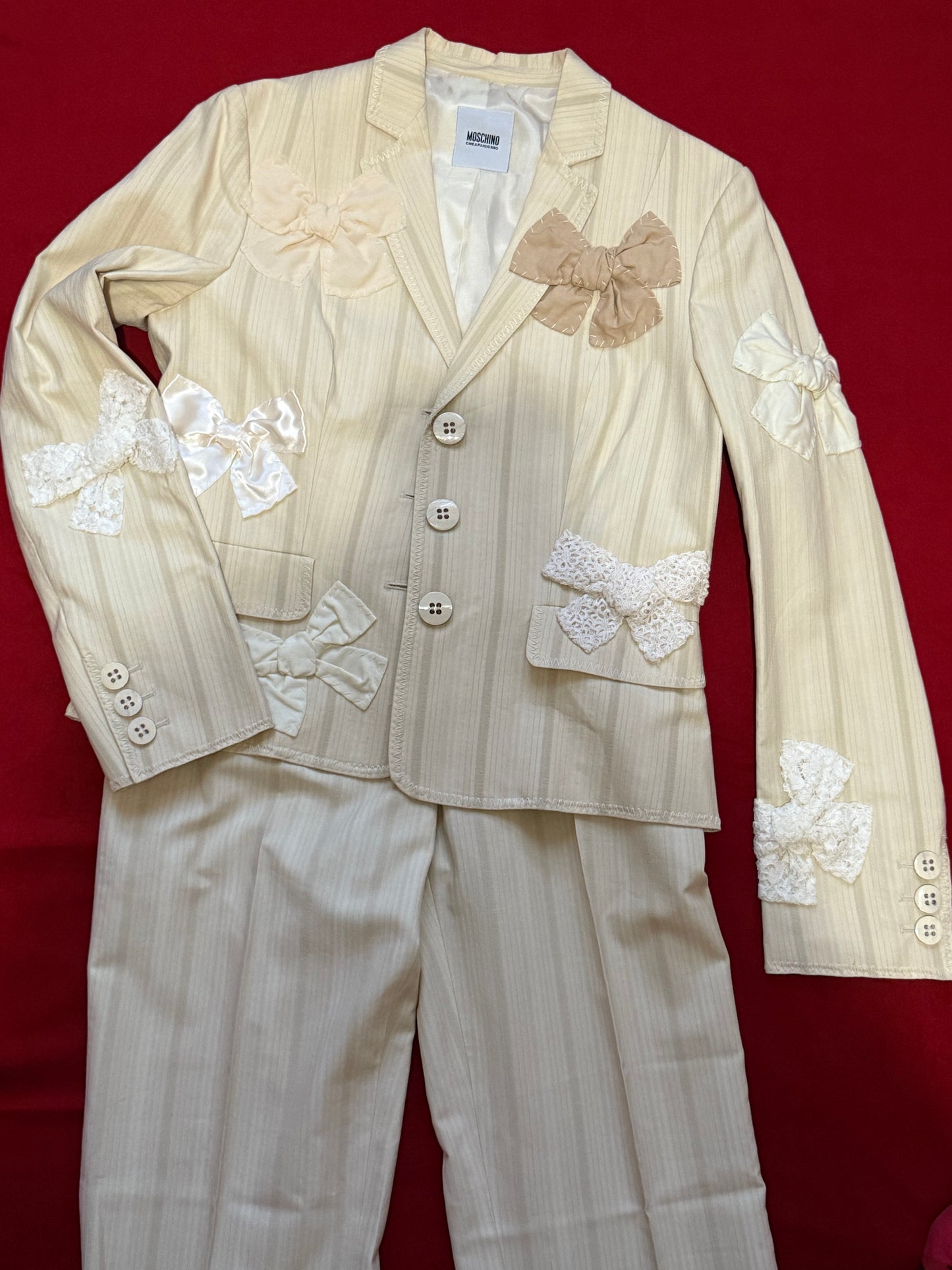 Moschino suit with bows