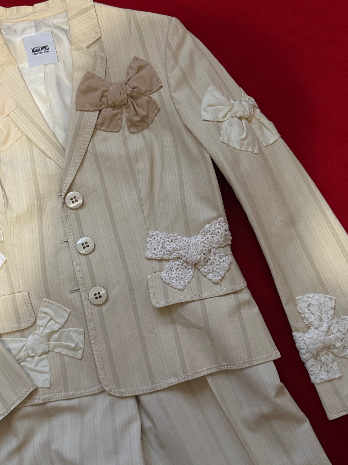 Moschino suit with bows