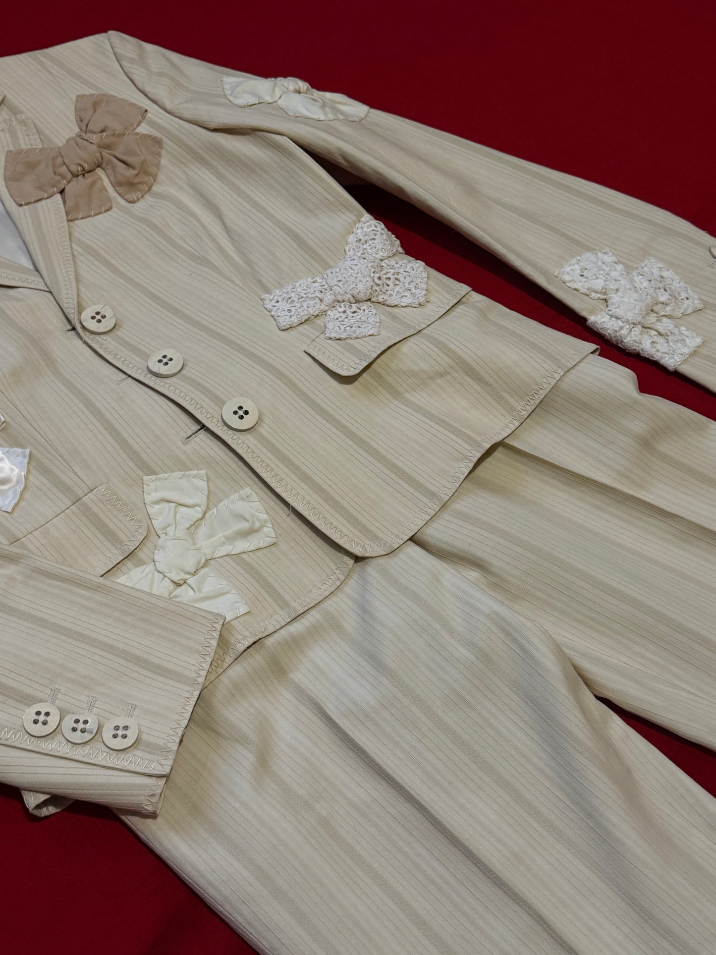 Moschino suit with bows
